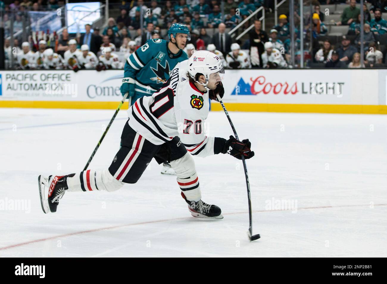 Chicago Blackhawks center Cole Guttman shoots against the San Jose Sharks during the second period of an NHL hockey game in San Jose, Calif., Saturday, Feb. 25, 2023. (AP Photo/John Hefti) Banque D'Images