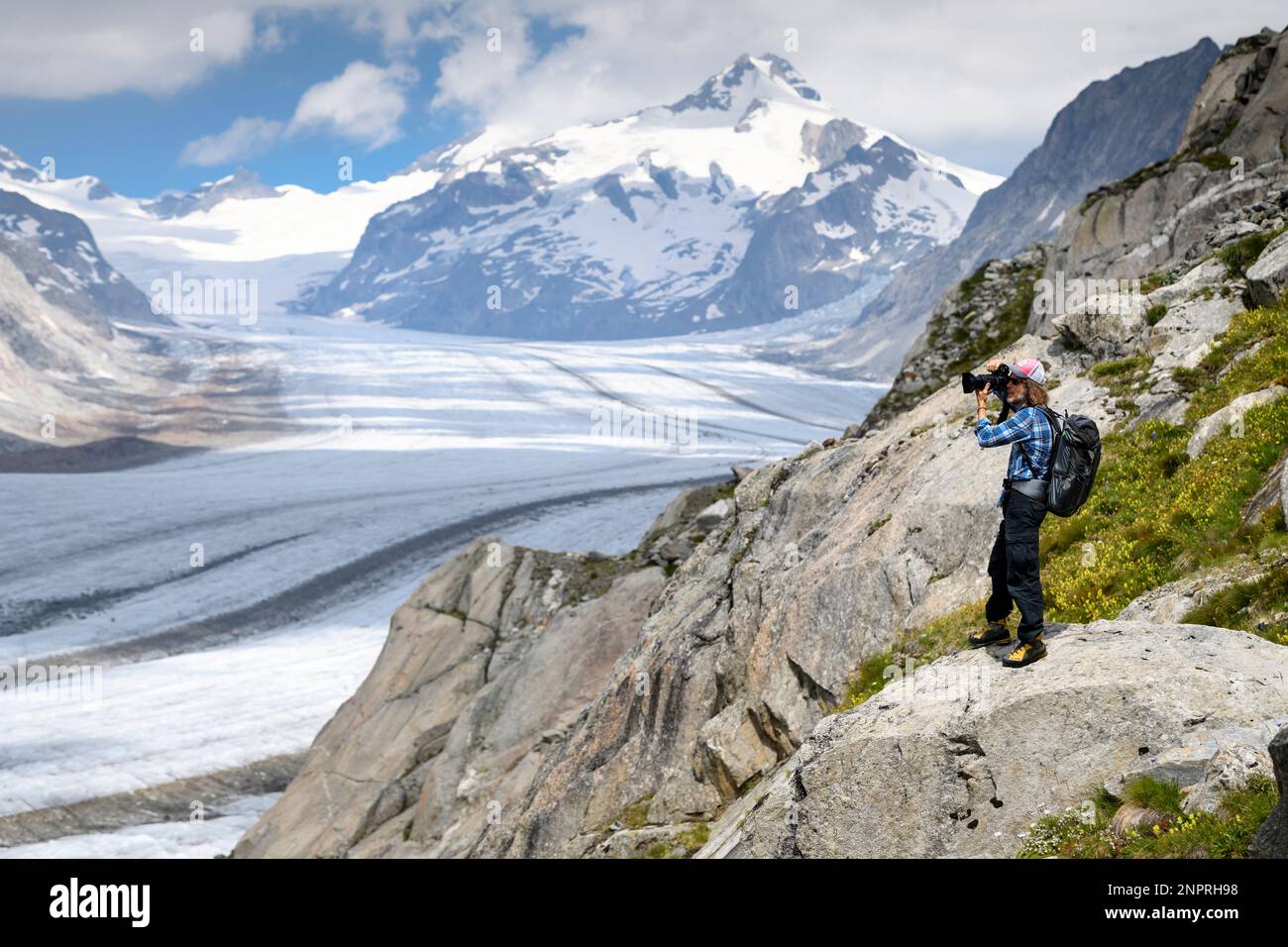 Swiss photographer David Carlier takes photographs the Swiss Aletsch glacier,  the longest glacier in Europe, on the sideline of his photographic  exhibition, in Fieschertal, Switzerland, Tuesday, July 21, 2020. With his  project "