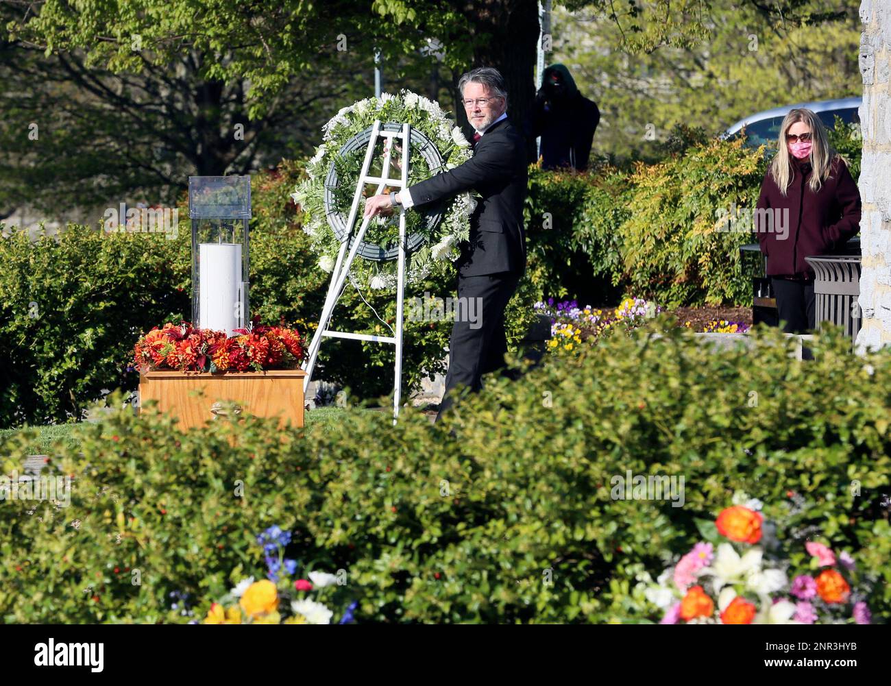 Virginia Tech President Tim Sands presents a wreath to mark the annual