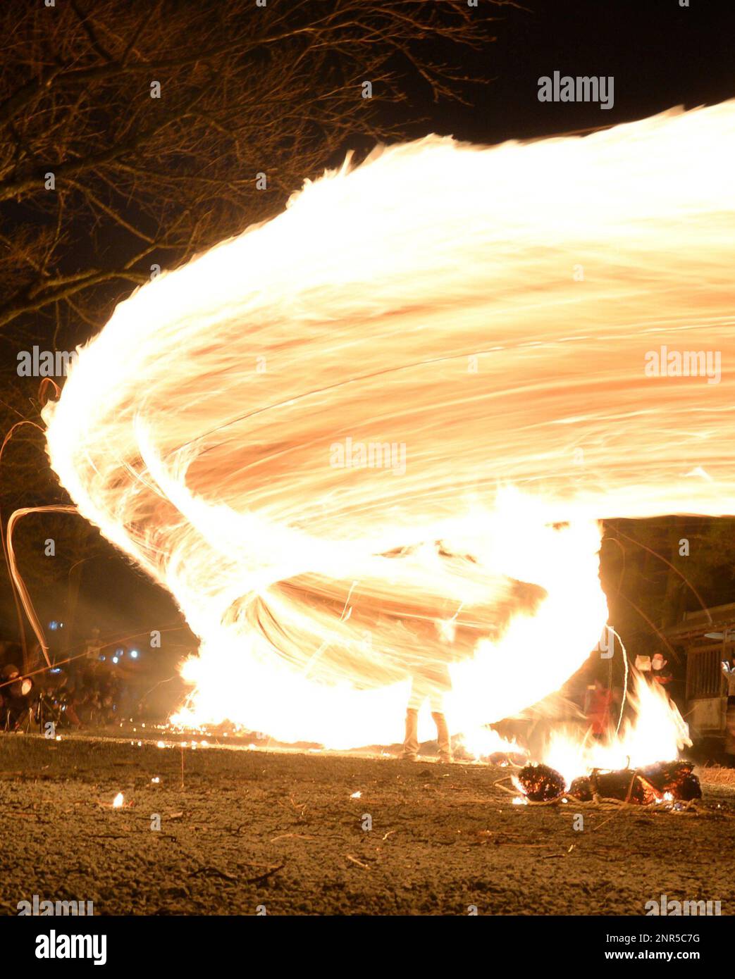 A long exposure photo shows Hiburi Shinji, Shintoism Swing Fire ...