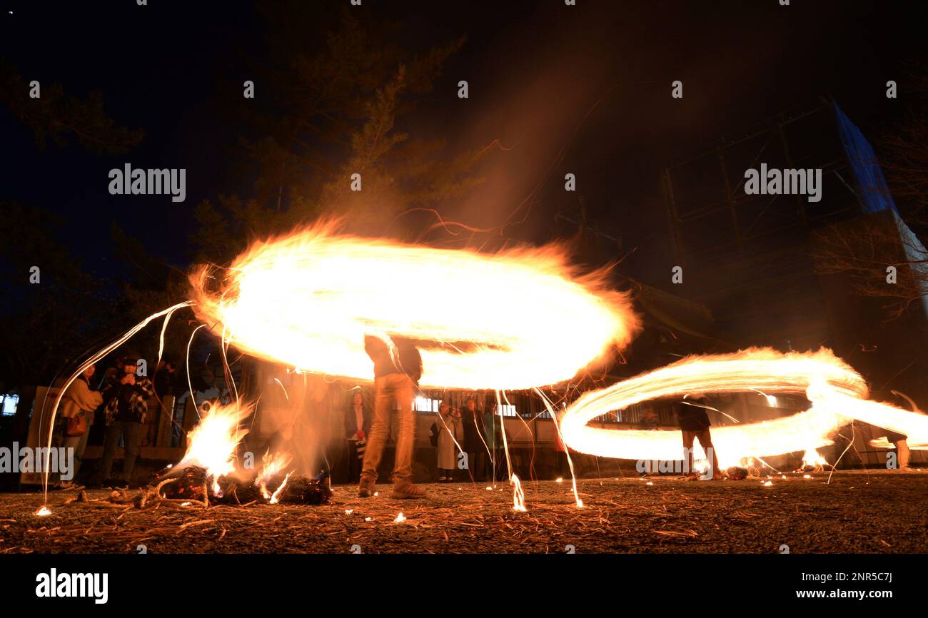 A long exposure photo shows Hiburi Shinji, Shintoism Swing Fire ...