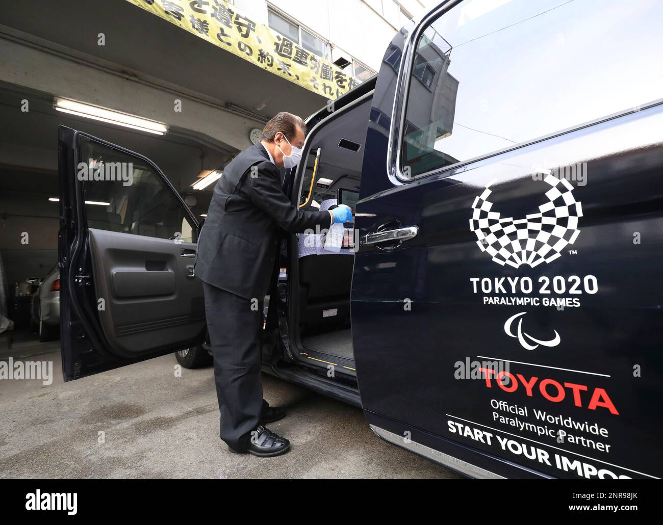 A Taxi Driver Disinfects His Vehicle Ahead Of Leaving For Work In.