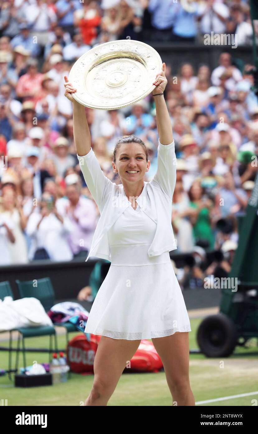 Simona Halep of Romania holds her victory trophy after winning the ladies' singles final of the Championships, Wimbledon against Serena Williams of U.S.A. at the All England Lawn Tennis and Croquet Club in London, United Kingdom on July 13, 2019. Simona Halep won the event to claim the championship. ( The Yomiuri Shimbun via AP Images ) Banque D'Images