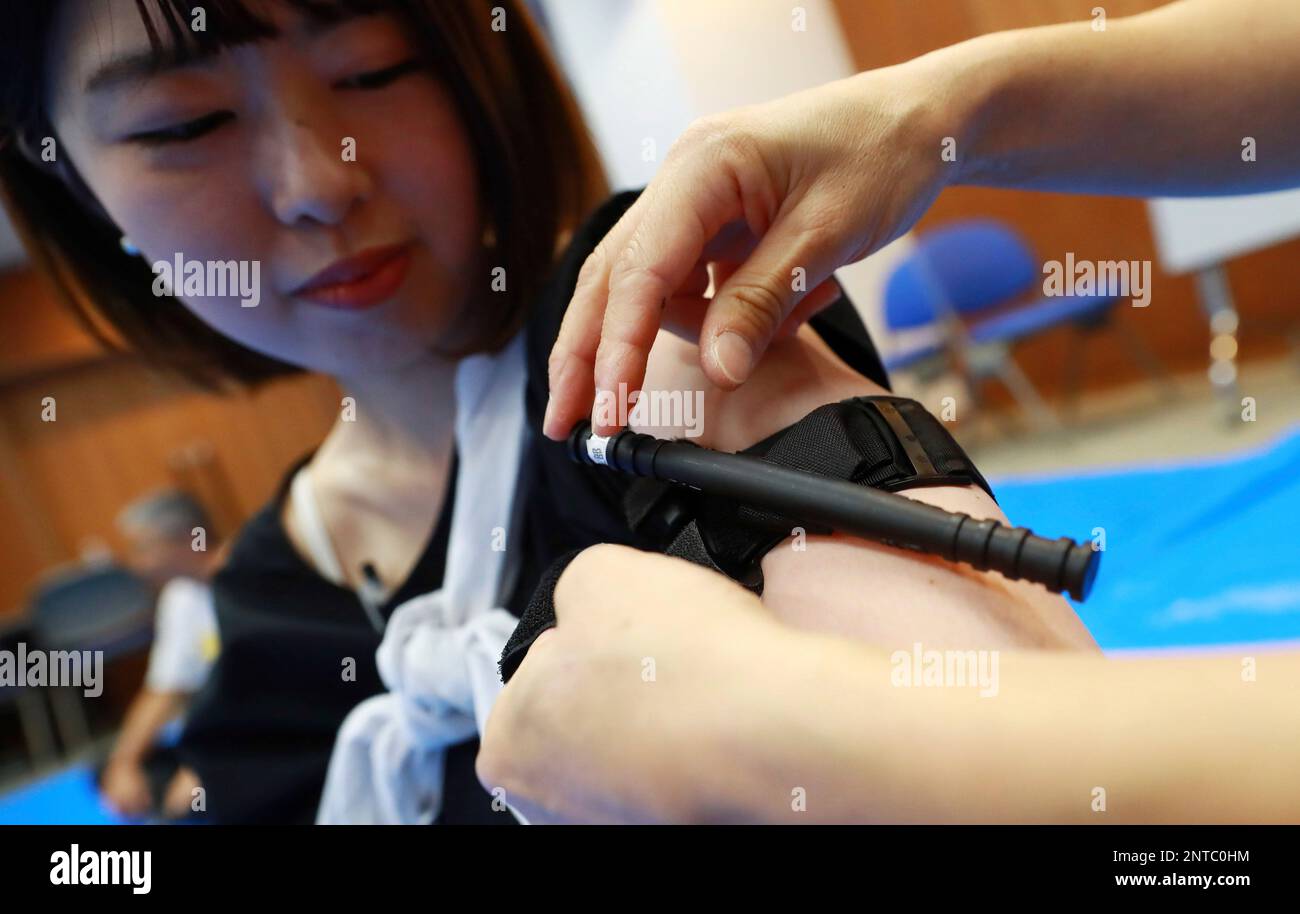 Participants learn how to use a tourniquet during first aid training at