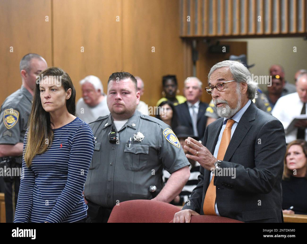 Attorney Andrew Bowman, right, speaks during the arraignment of his