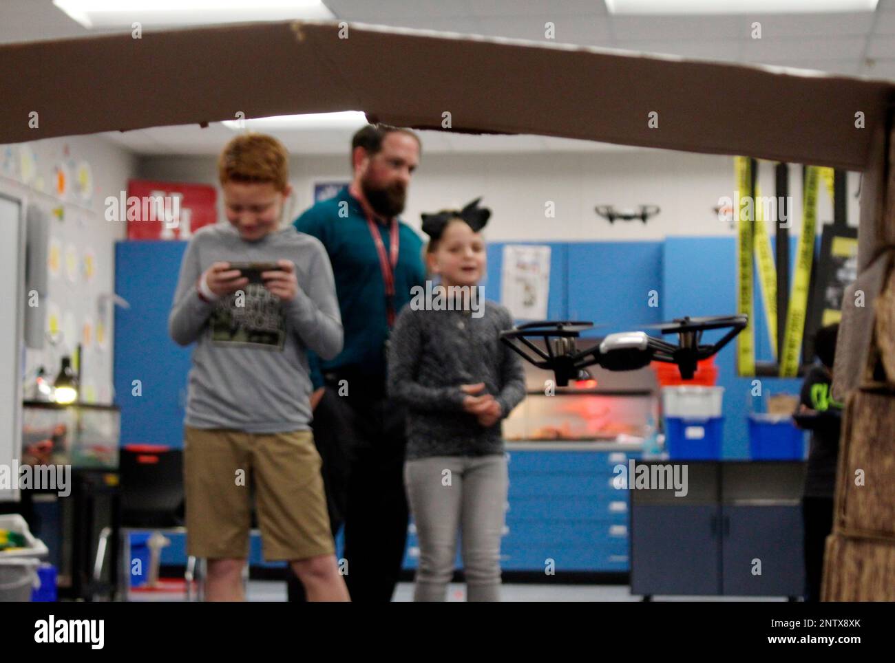 Picture of In this Feb. 6, 2019 photo, Vance Smyth, left, flies a drone through a ...