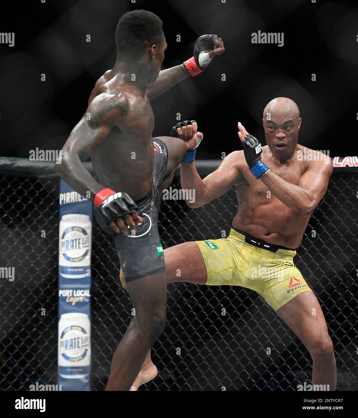 Nigeria's Israel Adesanya, left, and Brazil's Anderson Silva fight during their middleweight bout at the UFC 234 event in Melbourne, Australia, Sunday, Feb. 10, 2019. (AP Photo/Andy Brownbill) Banque D'Images