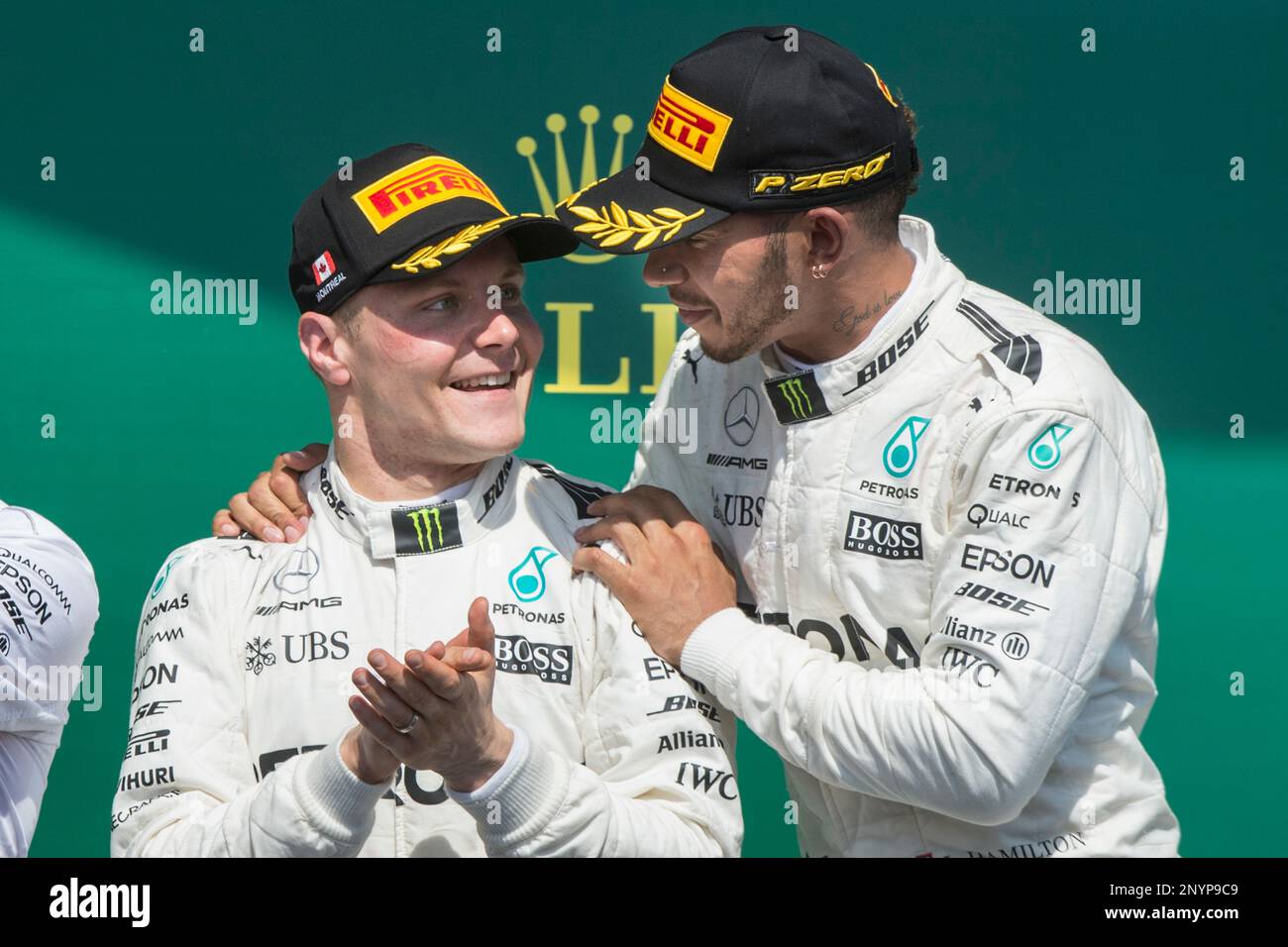 Canadian Grand Prix winner Mercedes driver Lewis Hamilton, right, of Britain, celebrates with teammate and second-place Valtteri Bottas (77) of Finland, Sunday, June 11, 2017 in Montreal. (Paul Chiasson/The Canadian Press via AP) Banque D'Images