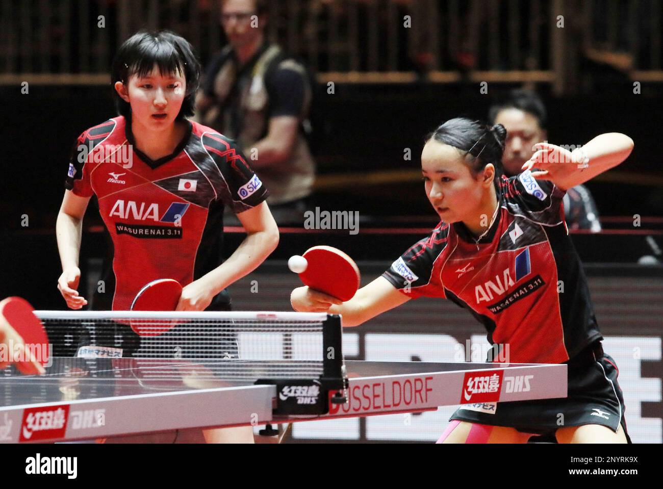 Japan's Mima Ito (R) and Hina Hayata return a ball to Doo Hoi Kem and Lee  Hoo Ching of Hong Kong China during the Women's doubles of the World Table  Tennis Championships