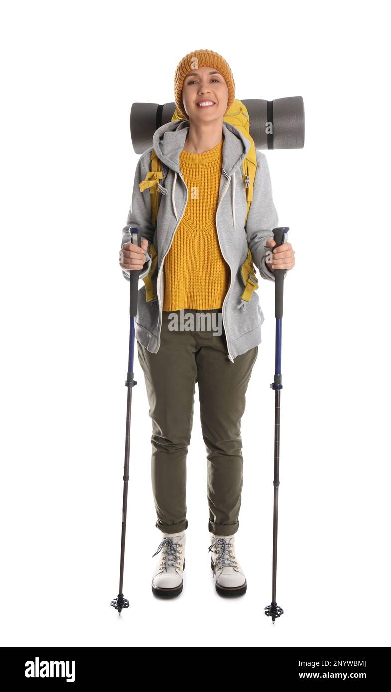 Randonneur féminin avec sac à dos et bâtons de randonnée sur fond blanc Banque D'Images