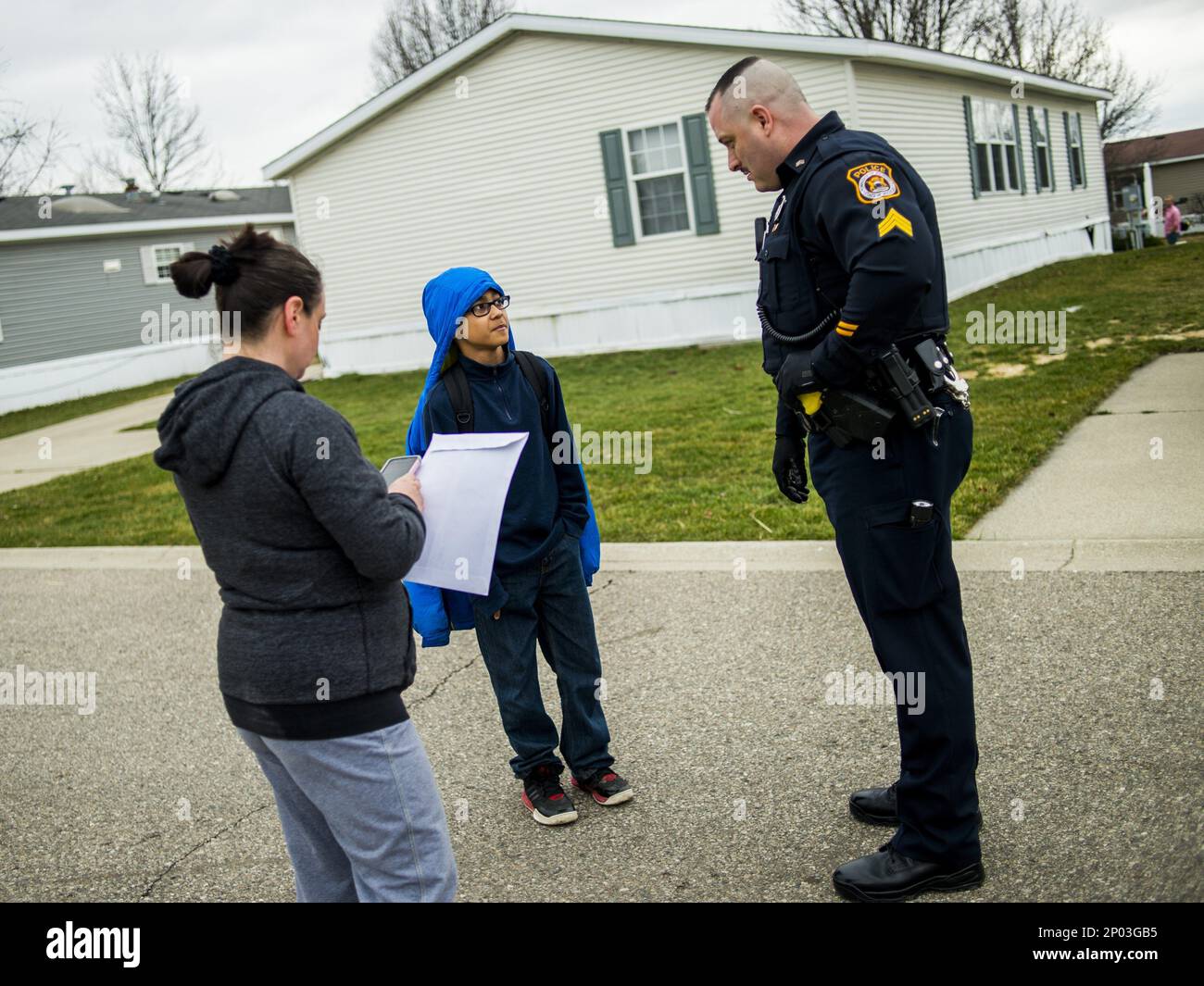 Richfield Township Sergeant Michael Bernard speaks with 11yearold son