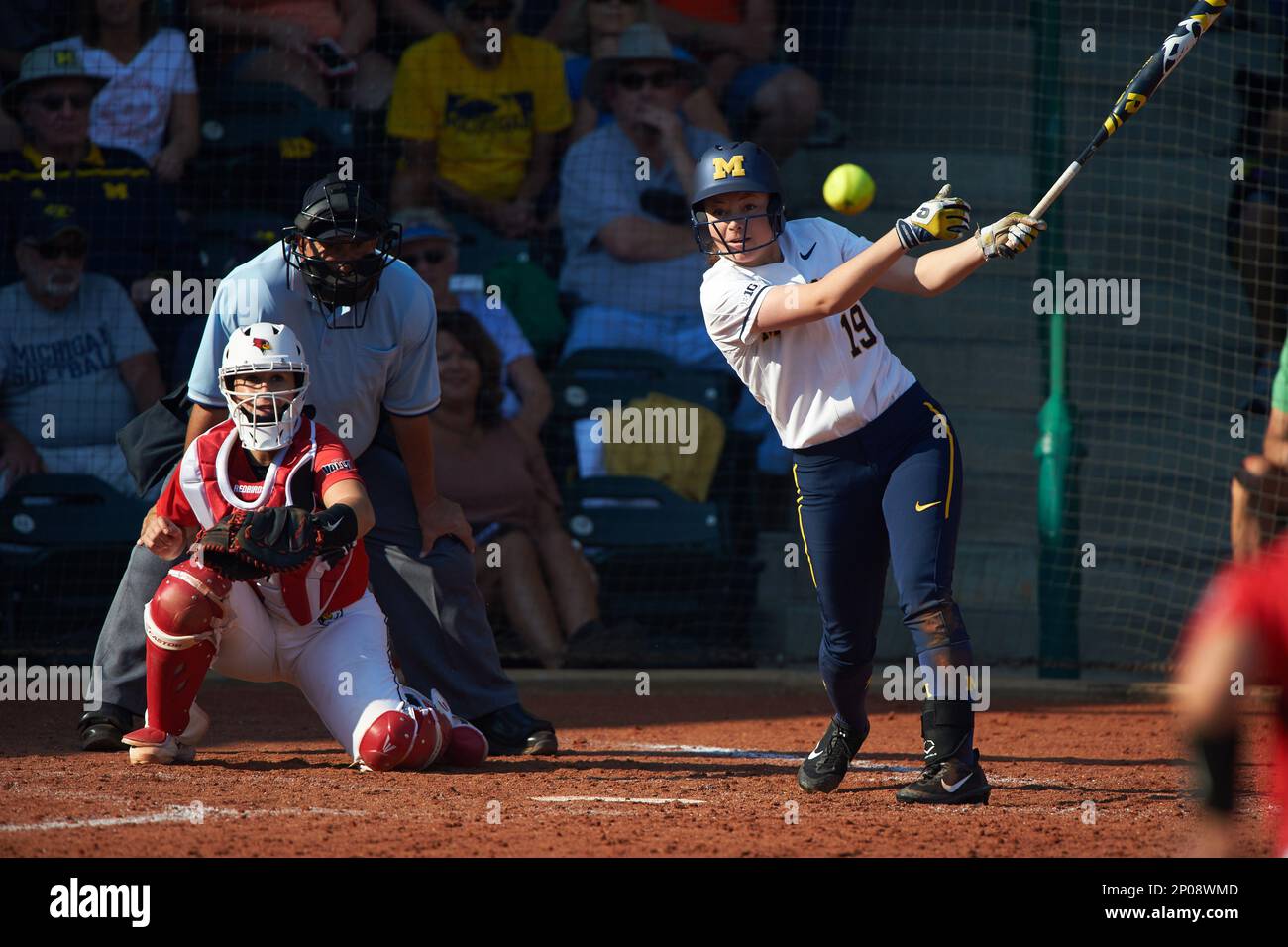 Michigan Wolverines Courtney Richardson (19) at bat in front of catcher