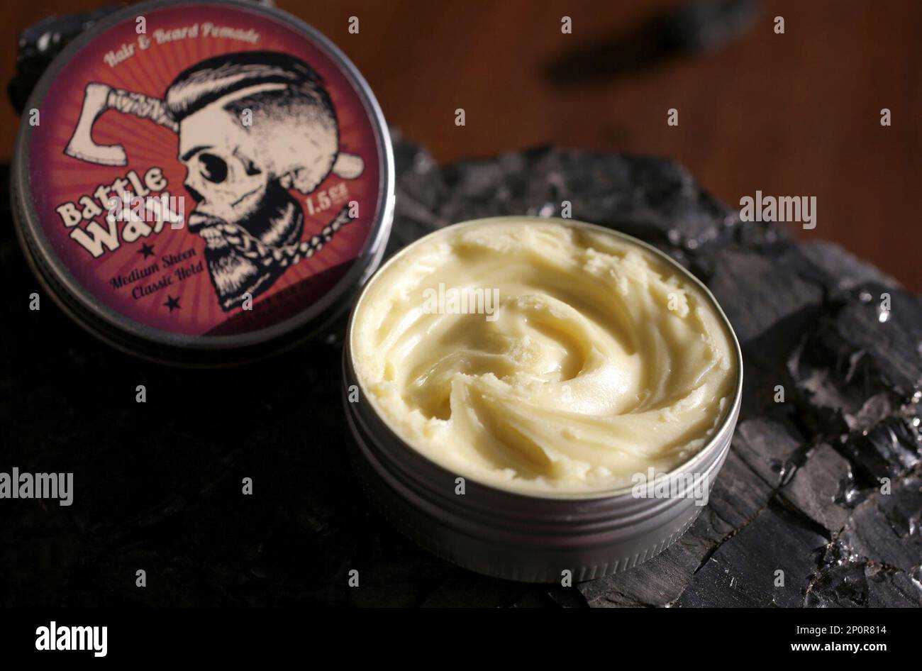 This Sept. 21, 2016 photo shows Lox Hair Wax Company's flagship product Battle Wax at Anthracite Barber Shop in Carbondale, Pa. ( Jake Danna Stevens/The Times-Tribune via AP) Banque D'Images