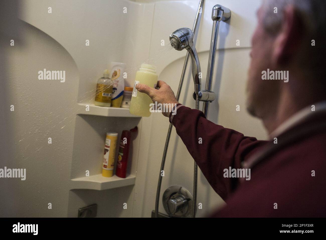 Plumber Harold Harrington collects samples for Water Defense from the ...