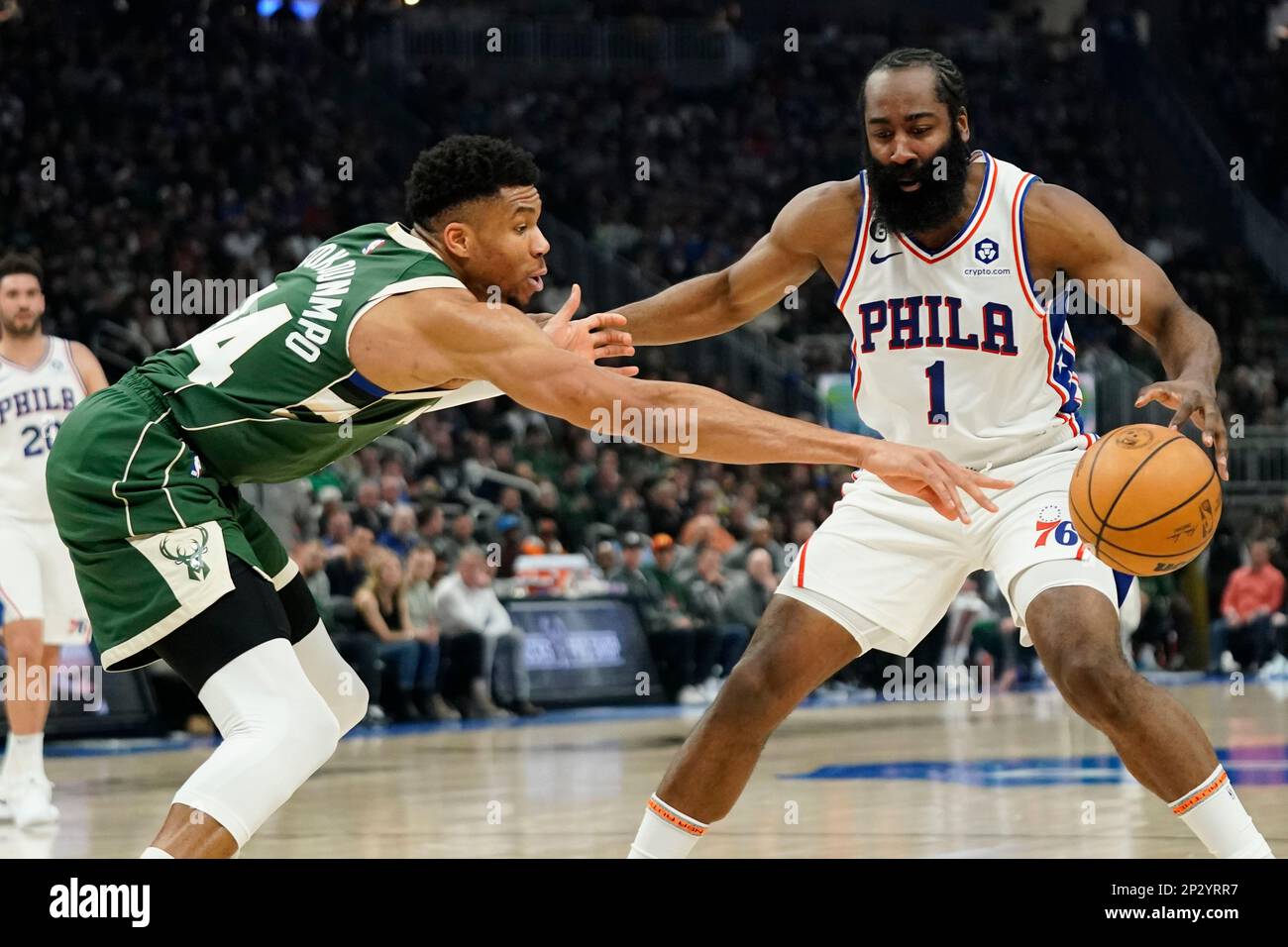 Philadelphia 76ers' James Harden (1) controls the ball against Milwaukee Bucks' Giannis Antetokounmpo during the first half of an NBA basketball game Saturday, March 4, 2023, in Milwaukee. (AP Photo/Aaron Gash) Banque D'Images