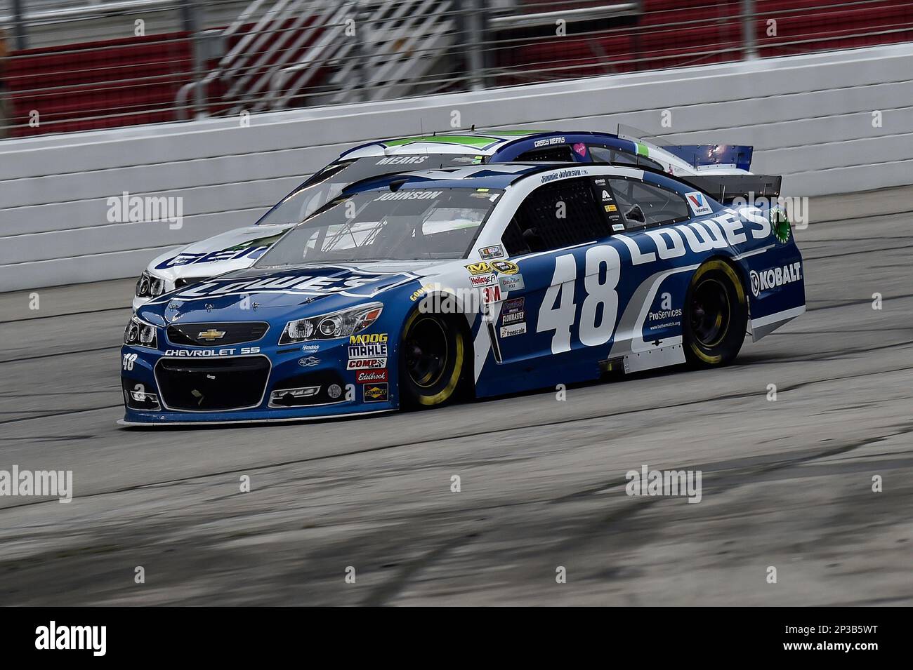 Jimmie Johnson (48) races with Casey Mears (13) during the NASCAR Sprint Cup Series Folds of Honor QuikTrip 500 at Atlanta Motor Speedway. Sunday, March 1, 2015, in Hampton GA. (AP Photo/NKP, John K Harrelson) MANDATORY CREDIT Banque D'Images