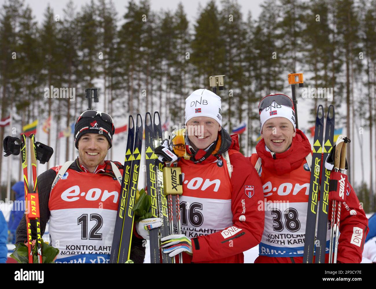 From left: Canada's Nathan Smith and Norway's Johannes Thingnes Bö and Tarjei Bö after the men's men's 10km sprint in the IBU Biathlon World Championships in Kontiolahti, Finland, on Saturday, March 7, 2015. (AP Photo/Lehtikuva, Markku Ulander) FINLAND OUT Banque D'Images
