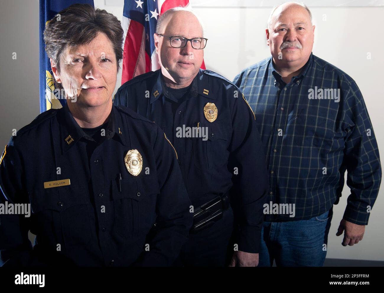 In this Feb. 12, 2015 photo, Lincoln Police Department captains, from left, Kim Koluch, Doug Srb and David Beggs pose for a photo at LPD's center team station in Lincoln, Neb. The three police captains with a combined total of 123 years of experience are leaving the Lincoln police force. (AP Photo/The Journal-Star, Gwyneth Roberts) LOCAL TELEVISION OUT; KOLN-TV OUT; KGIN-TV OUT; KLKN-TV OUT Banque D'Images