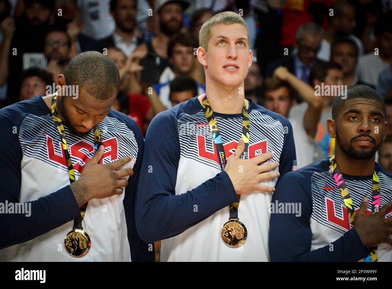 September 14, 2014: C DeMarcus Cousins (12) of Team USA, C Mason Plumlee (11) of Team USA and G Kyrie Irving (10) of Team USA listen to the National Anthem after winning the championship after Team USA defeats Serbia in the 2014 FIBA Basketball World Cup championship at Palacio de los Deportes Stadium in Madrid, Spain. USA won 129-92.***** NORTH AND SOUTH AMERICA ONLY ---- AGENTS OUT ---- NORTH AND SOUTH AMERICA ONLY ***** (Icon Sportswire via AP Images) Banque D'Images