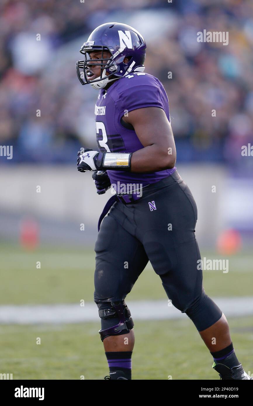 Northwestern defensive lineman Deonte Gibson (13) runs during a NCAA Football game against the Michigan Wolverines in Evanston, Illinois on Saturday, November 8, 2014. Michigan defeated Northwestern 10-9. (AP Photo/Scott Boehm) Banque D'Images