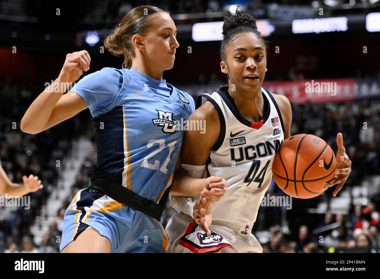 Marquette's Emily La Chapell (21) guards against UConn's Aubrey Griffin