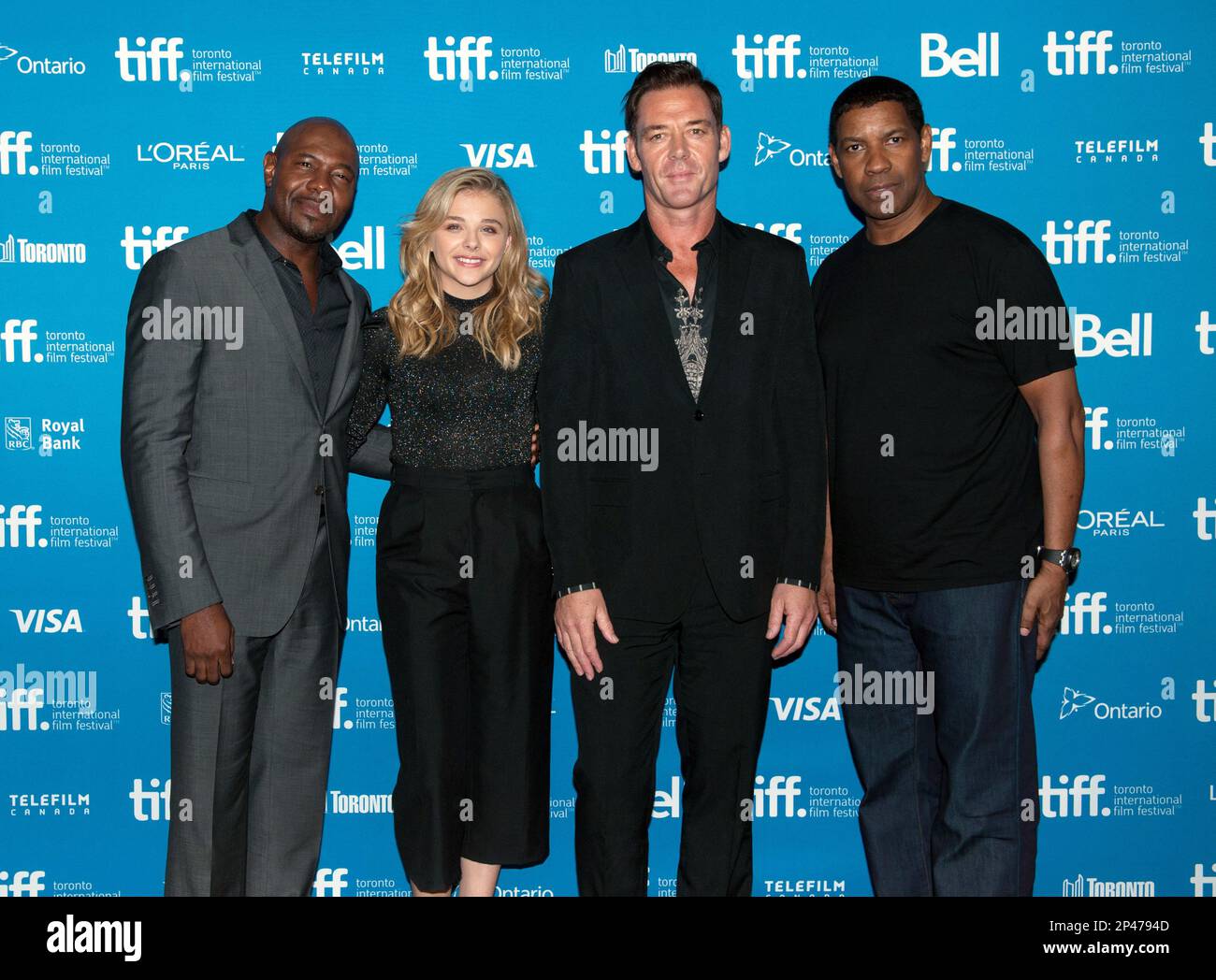 Director Antoine Fuqua, from left, actors Chloe Grace Moretz, Marton  Csokas, and Denzel Washington pose at a photo call for"The Equalizer" at  the 2014 Toronto International Film Festival in Toronto on Sunday,