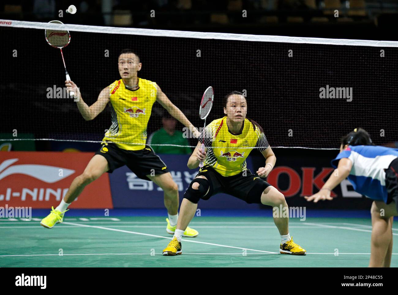 China's top seeded mixed double Zhang Nan, left, and Zhao Yunlei return ...