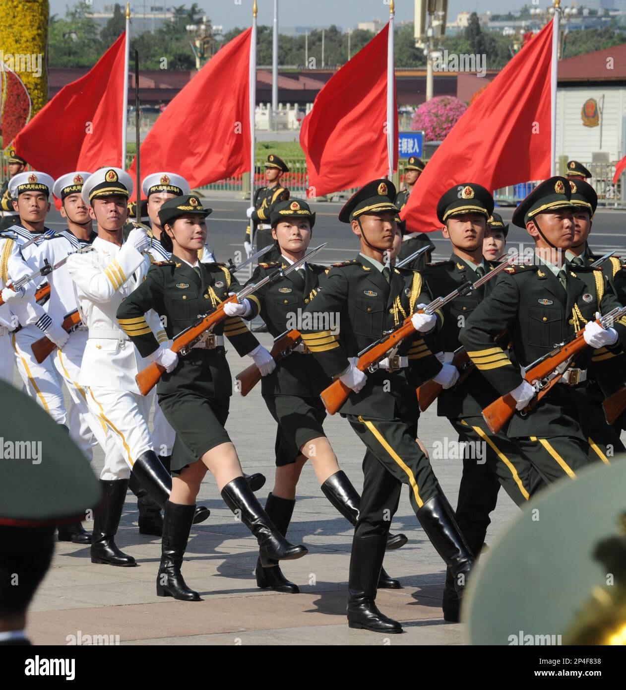 Chinese female People’s Liberation Army honour guards parade with male ...