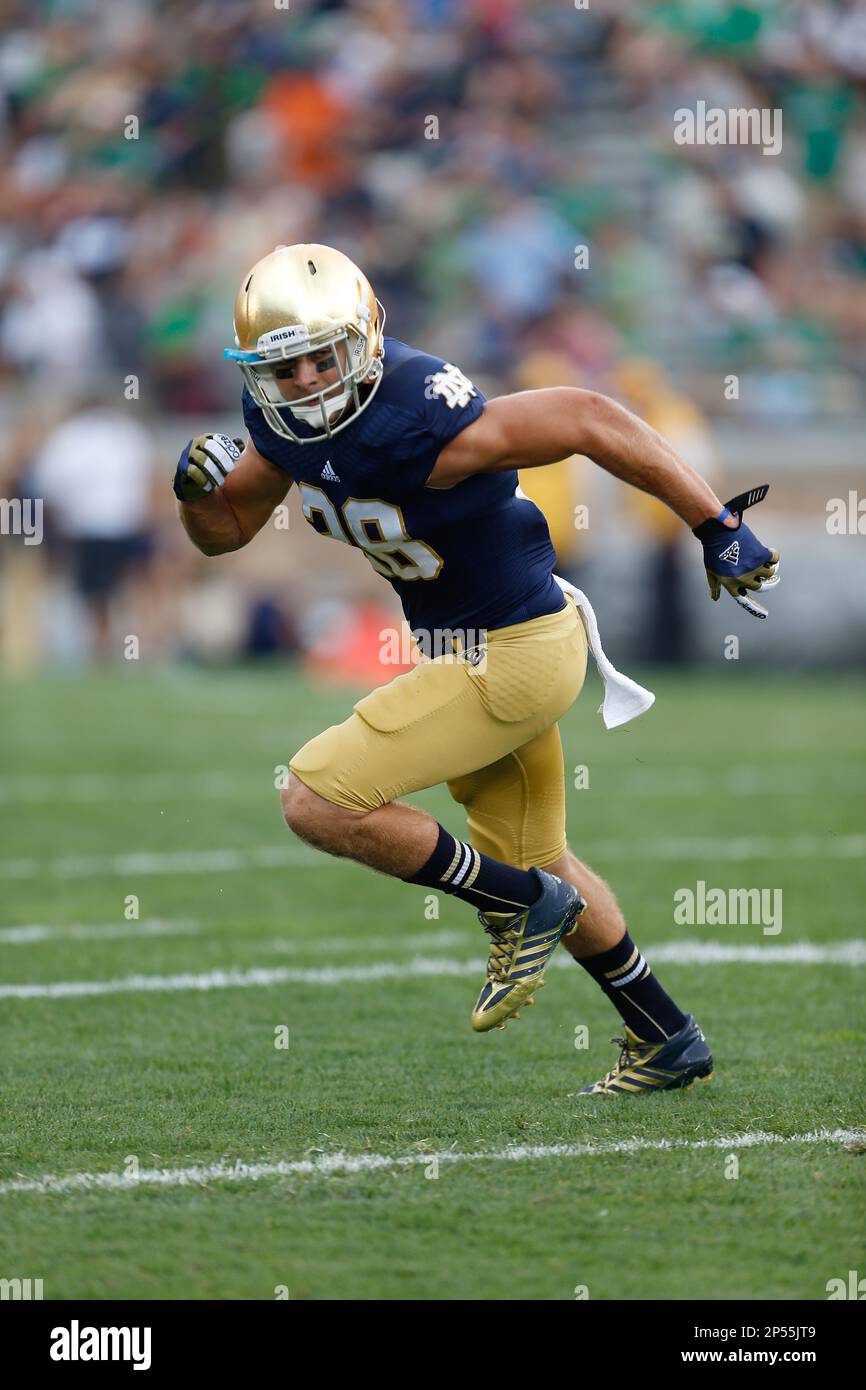 Notre dame safety austin collinsworth 28 runs during ncaa football
