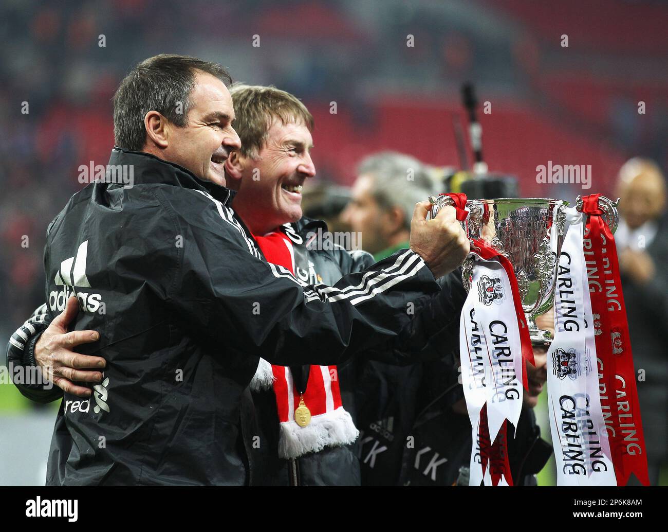 Kenny Dalglish manager of Liverpool with Steve Clarke his assistant hold the Carling Cup after winning the Carling Cup..Cardiff City v Liverpool during the Carling Cup Final..Cardiff City v Liverpool during the Carling Cup Final, London..26th February, 2012. (Cal Sport Media via AP Images) Banque D'Images