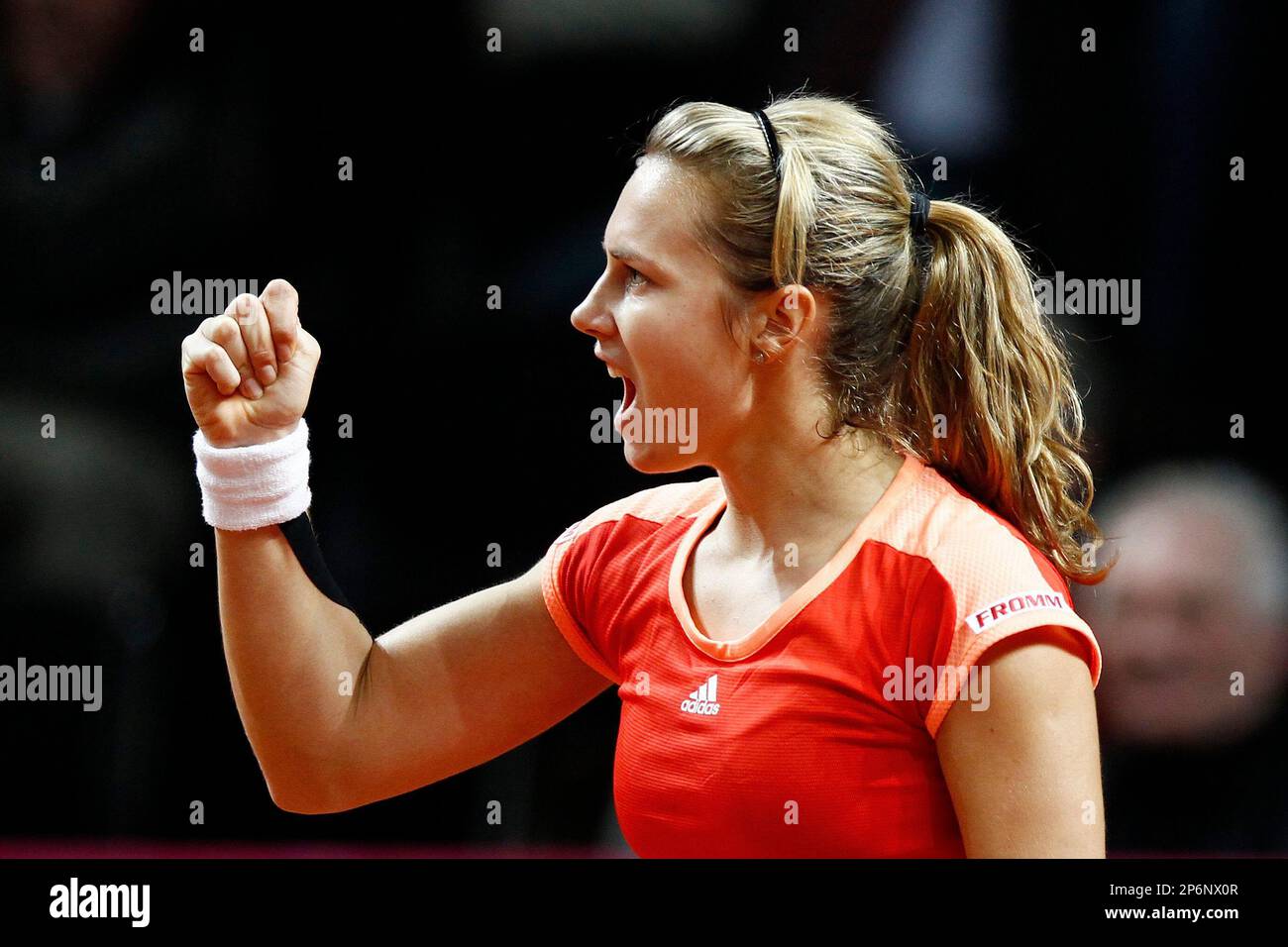 Switzerland's Stefanie Voegele reacts after winning her match against Australia's Jarmila Gajdosova during the Fed Cup World Group 2 first round tennis match in the Forum Arena in Fribourg, Switzerland, Saturday, Feb. 4, 2012. Voegele won the match 6-0, 6-7, 8-6. (AP Photo/Keystone/Peter Klaunzer) Banque D'Images