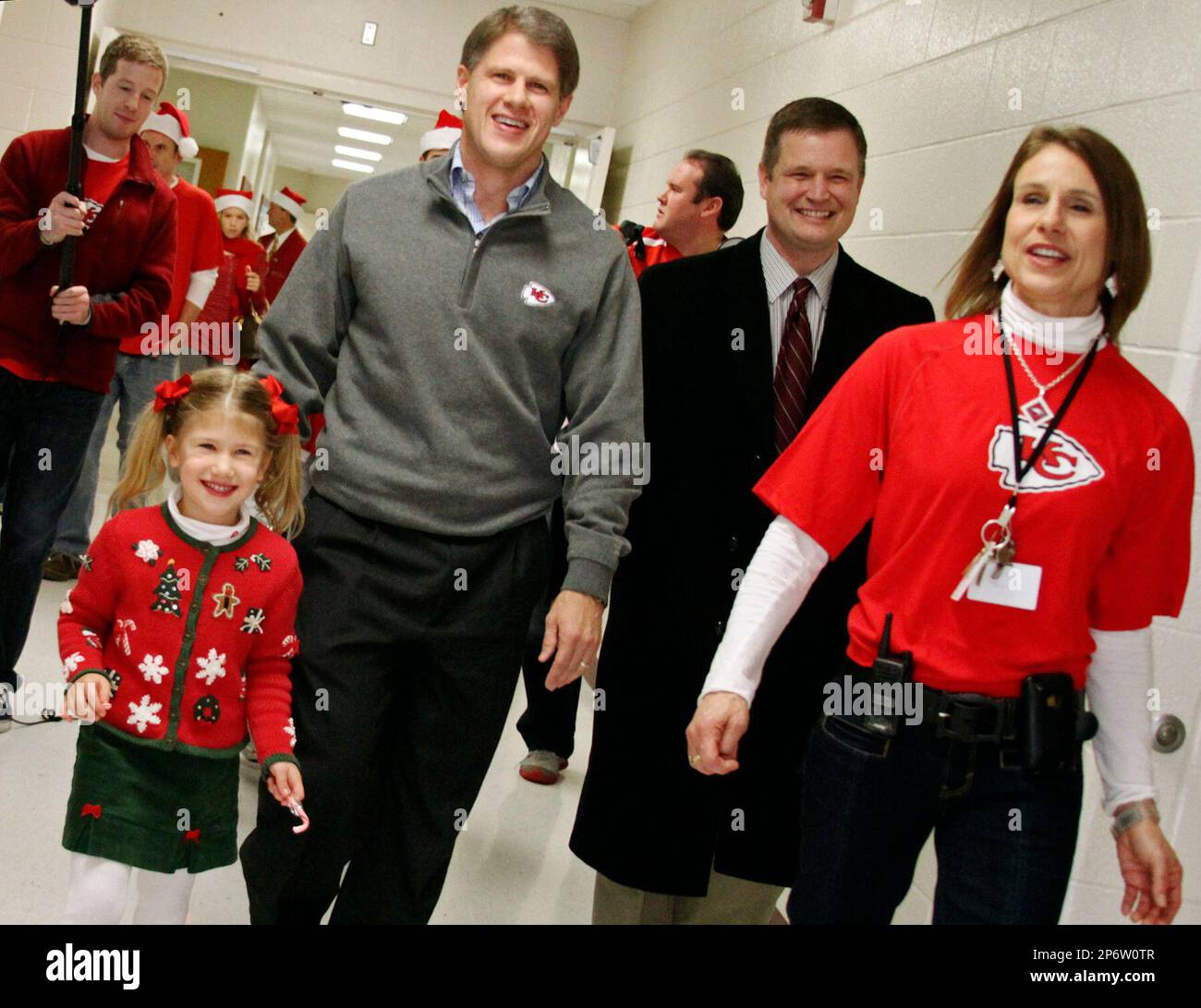 Kansas City Chiefs Chairman and CEO Clark Hunt, second from left, walks