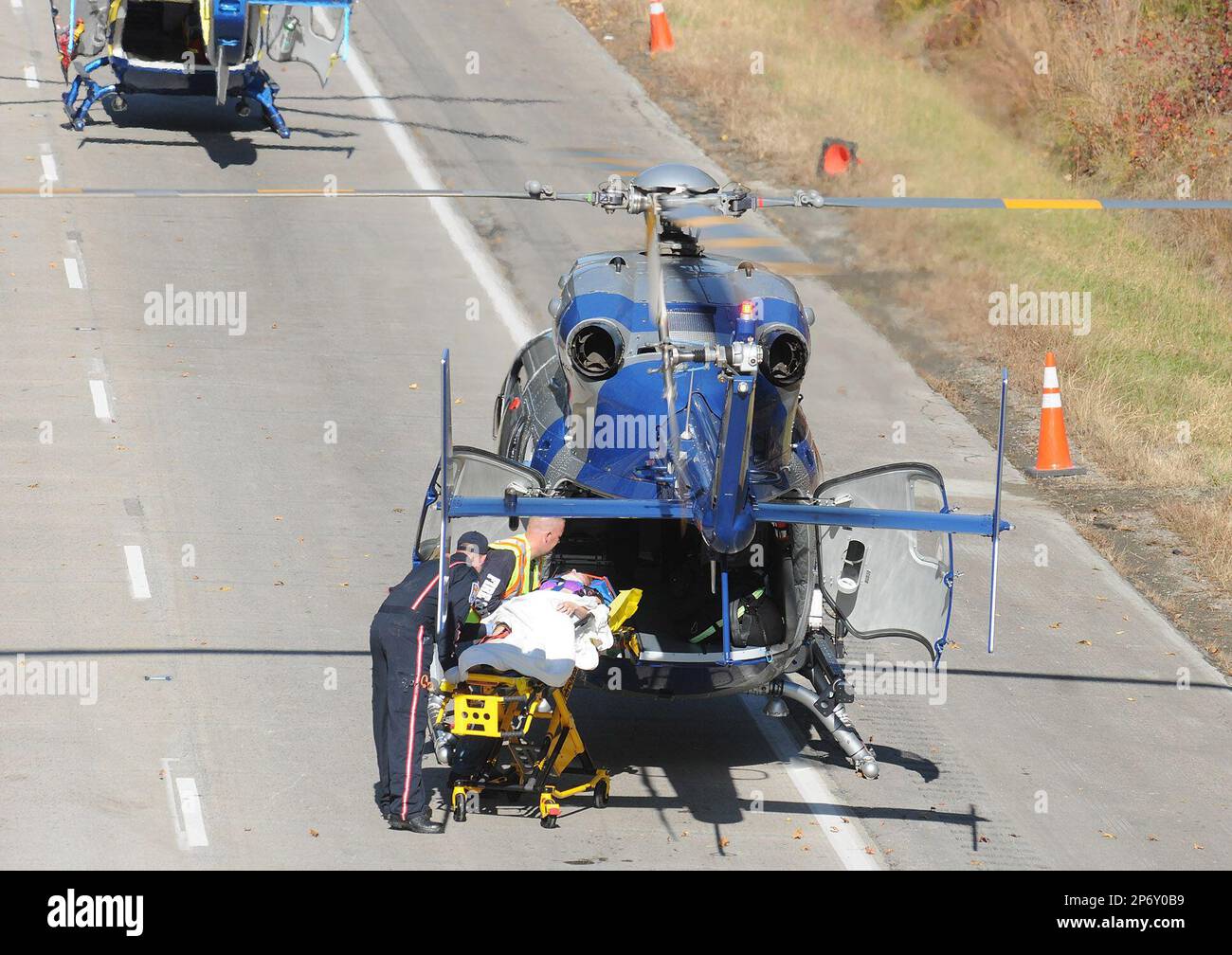 An injured woman is loaded into a Virginia State Police helicopter for