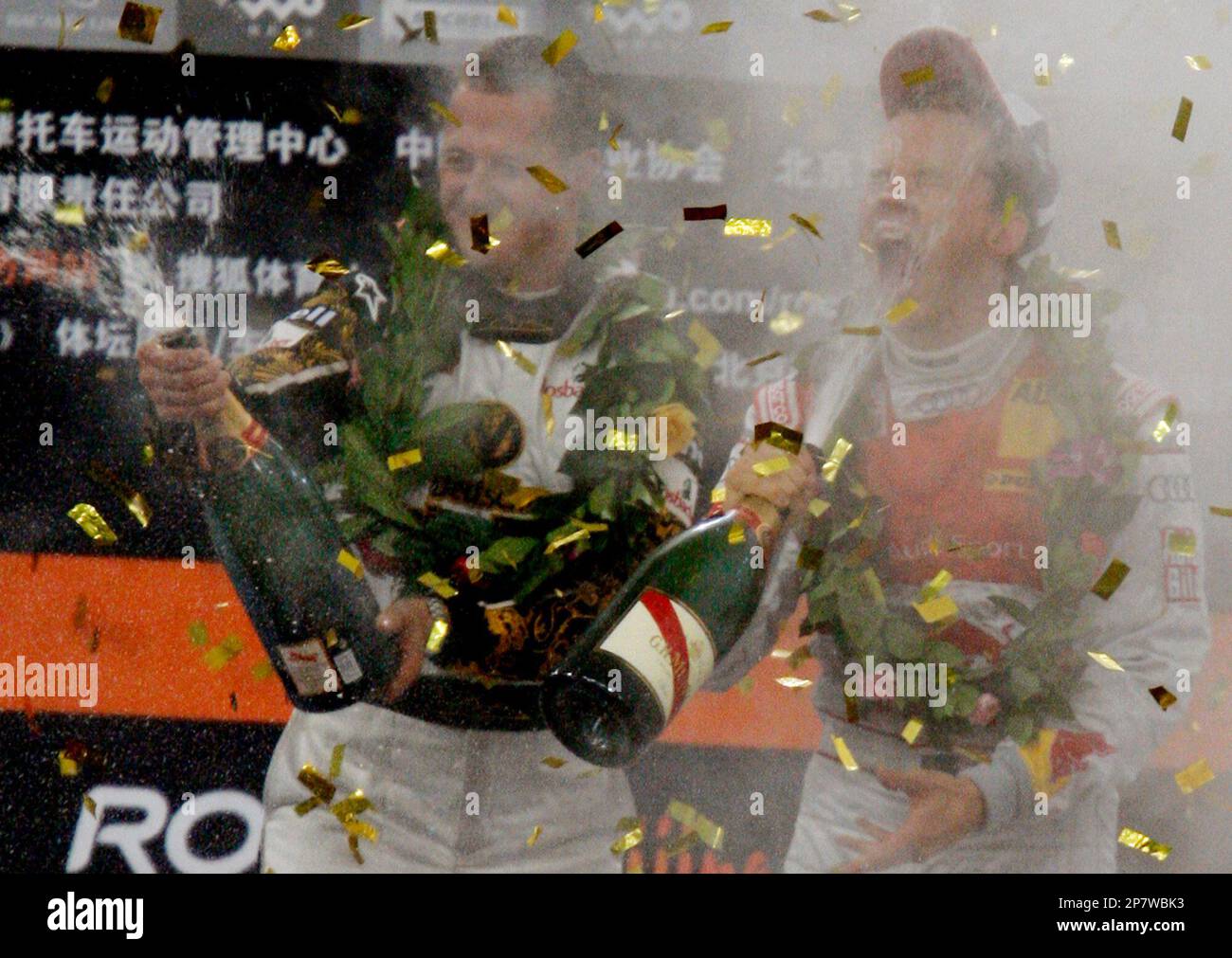 Race of Champions winner Sweden's Mattias Ekstrom, right, sprays