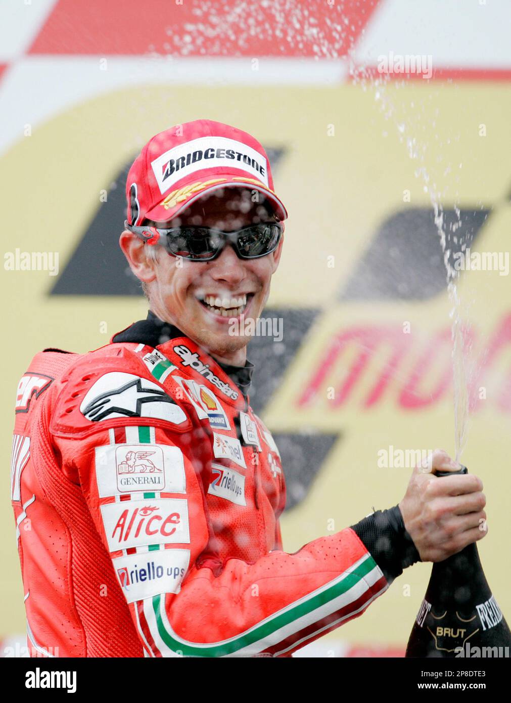 Ducati's Casey Stoner, of Australia, sprays sparkling wine on the podium after winning the MotoGP race at the Mugello circuit, in Scarperia, Italy, Sunday, May 31, 2009. (AP Photo/Gregorio Borgia) Banque D'Images