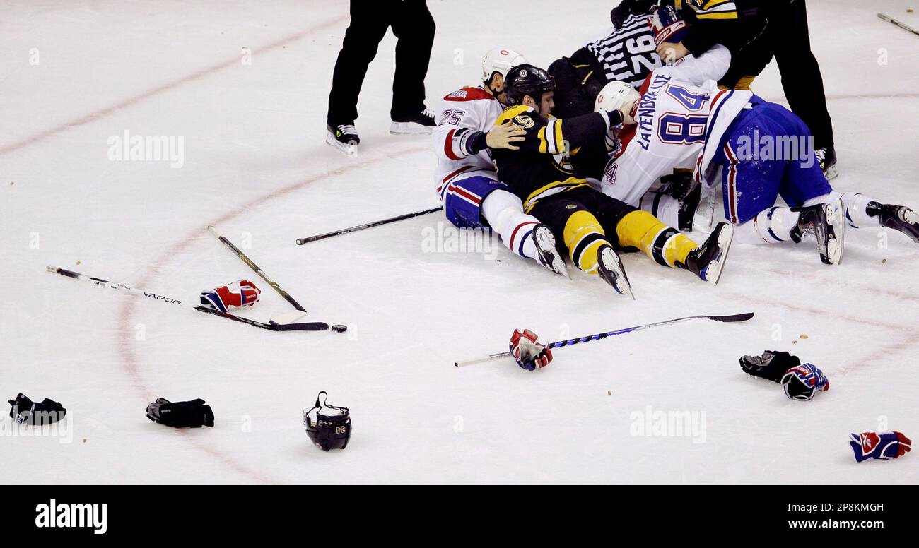 With gloves, helmets and sticks across the ice, Boston Bruins