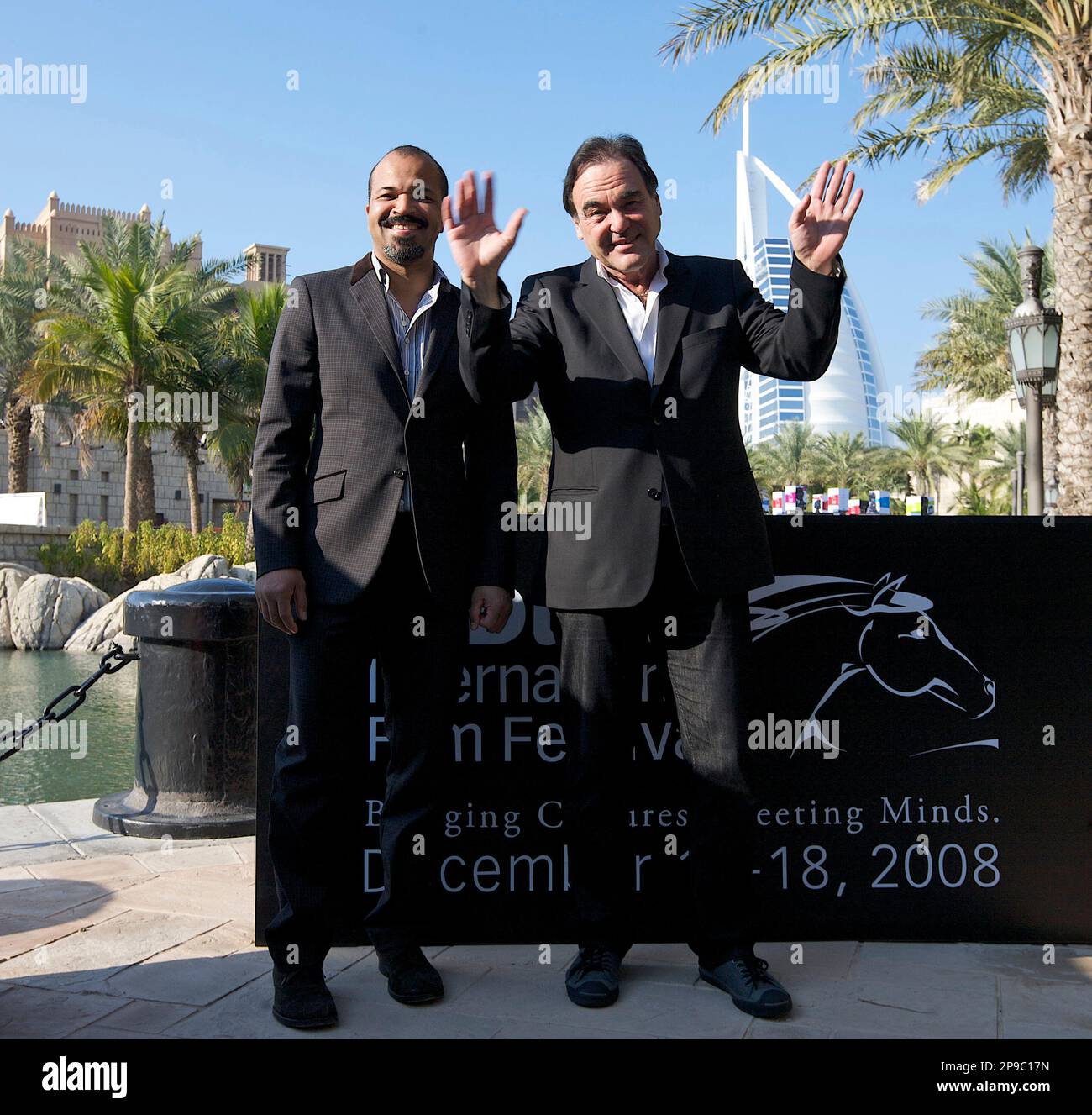 American director, Oliver Stone, right, and actor Jeffrey Wright with the iconic Burj Al Arab hotel in the background after their press conference ahead of the opening night of the 5th Dubai International Film Festival in Dubai, United Arab Emirates,Thursday, Dec. 11, 2008. (AP Photo/Nousha Salimi) Banque D'Images