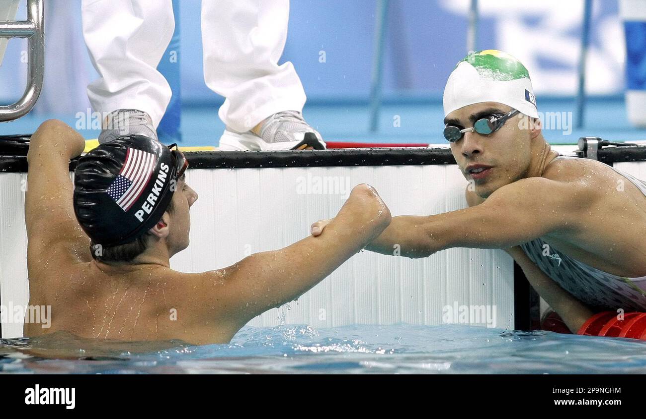 Brazil's Daniel Dias, right, is congratulated by Roy Perkins, of the United States, after Dias won gold in the Men's 100 meters Freestyle S5 at the 2008 Beijing Paralympic Games in Beijing Sunday Sept. 7, 2008. (AP Photo/Greg Baker) Banque D'Images