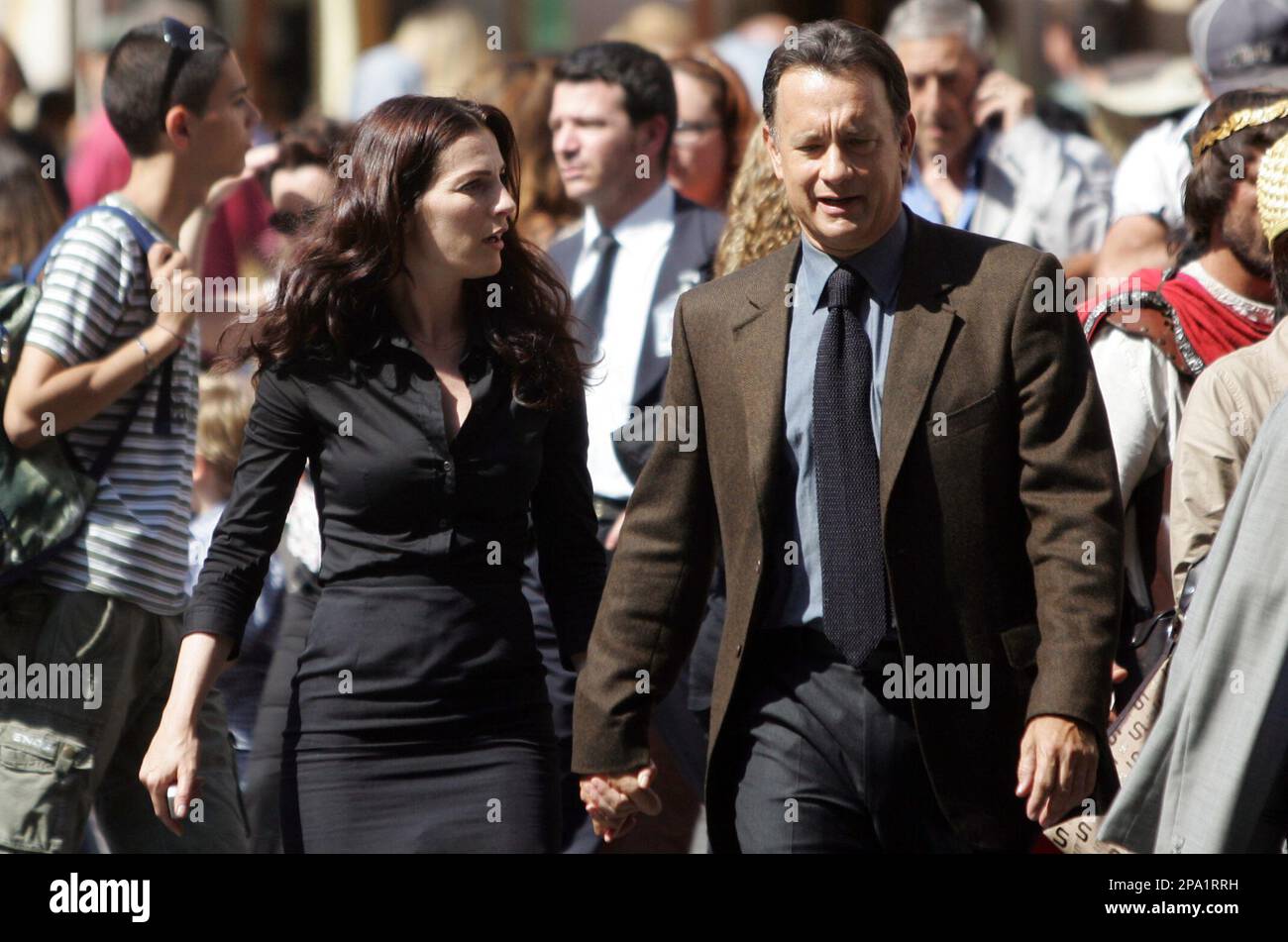 U.S. actor Tom Hanks walks hand in hand with Israeli actress Ayelet Zurer  during the shooting of the movie "Angels and Demons" in downtown Rome,  Monday, June 9, 2008. (AP Photo/Riccardo De