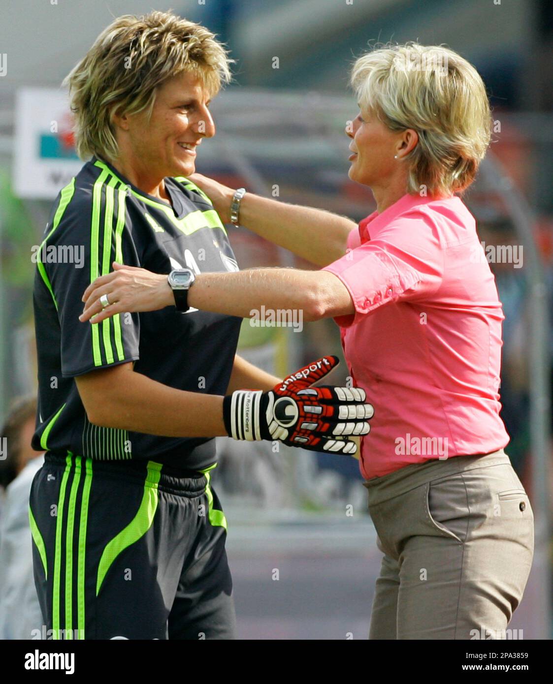 German national goalkeeper Silke Rottenberg, left, is embraced by German  national coach Silvia Neid as she leaves the pitch in the 83rd minute of  the European qualification match Germany against Wales in