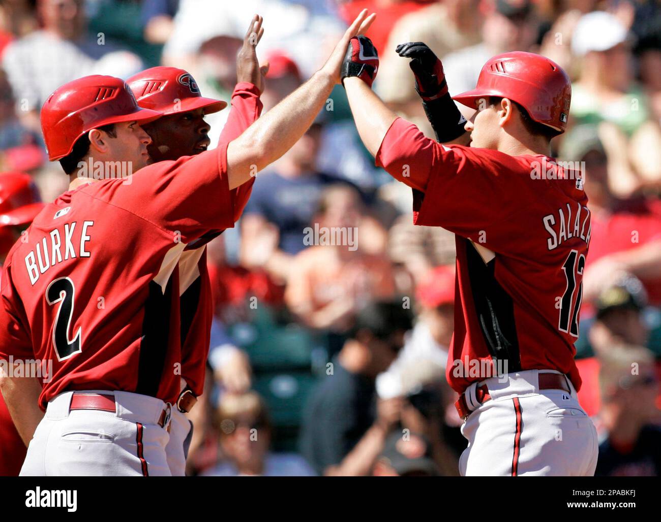 Arizona Diamondbacks' Jeff Salazar, right, is congratulated by Chris
