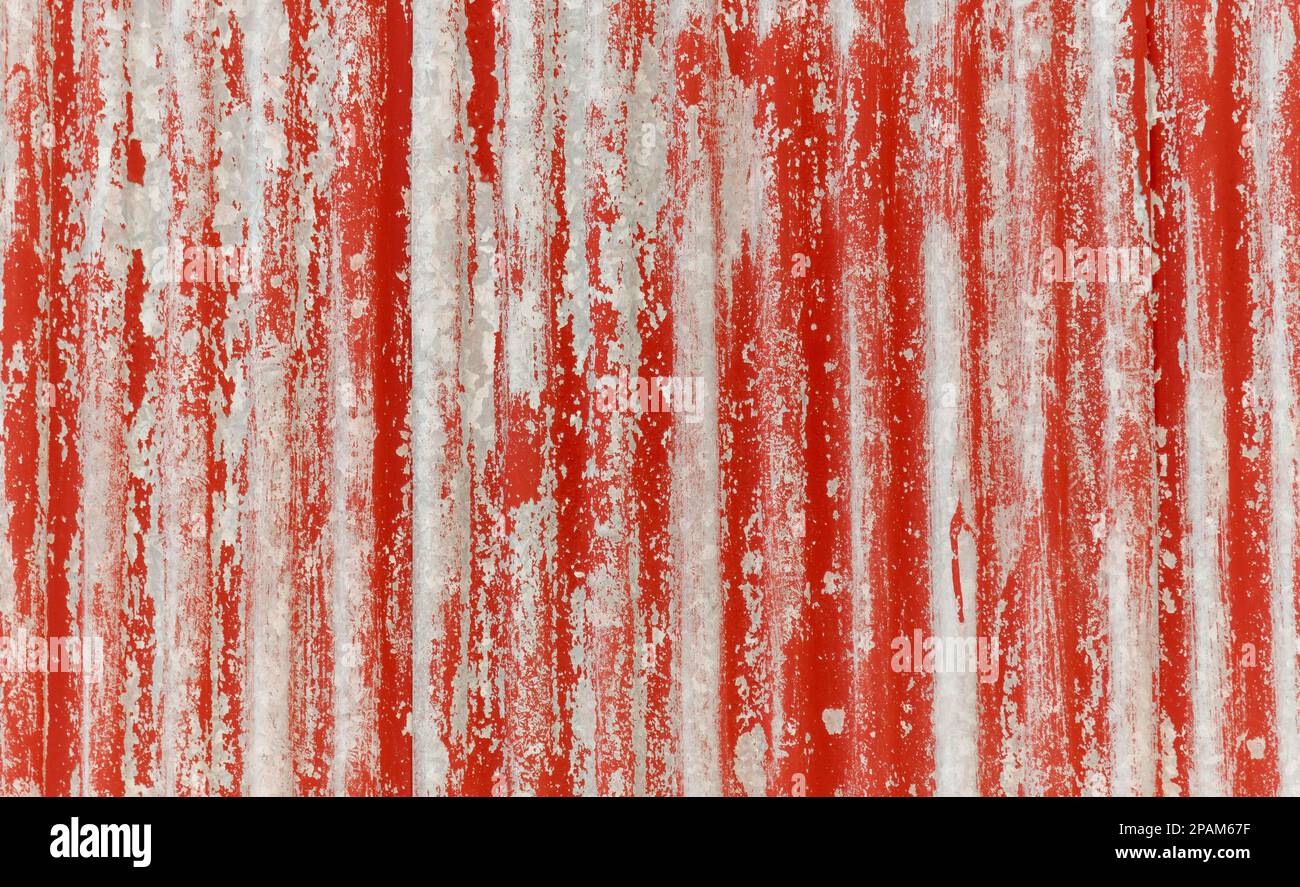 Feuilles ondulées peintes en rouge pour un arrière-plan, une texture et un recouvrement. Banque D'Images
