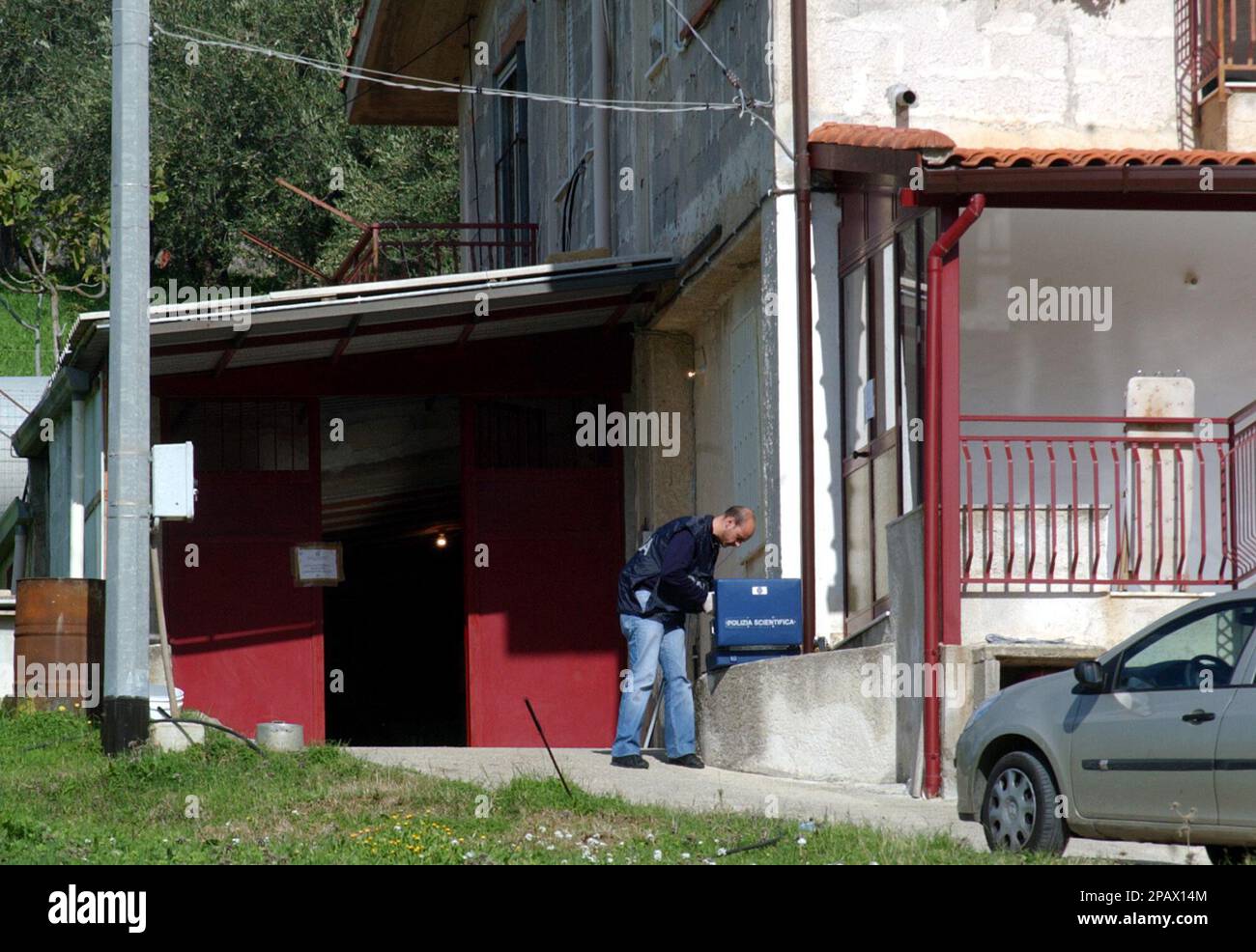 A forensic police officer inspects an house, Tuesday, Nov. 6, 2007, the ...