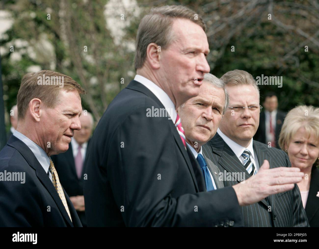 President Bush, third from right, stands with auto company executives