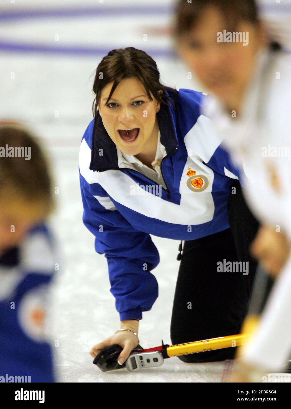 Team Scotland's Lindsay Wood , center, screams as teammates Lorna