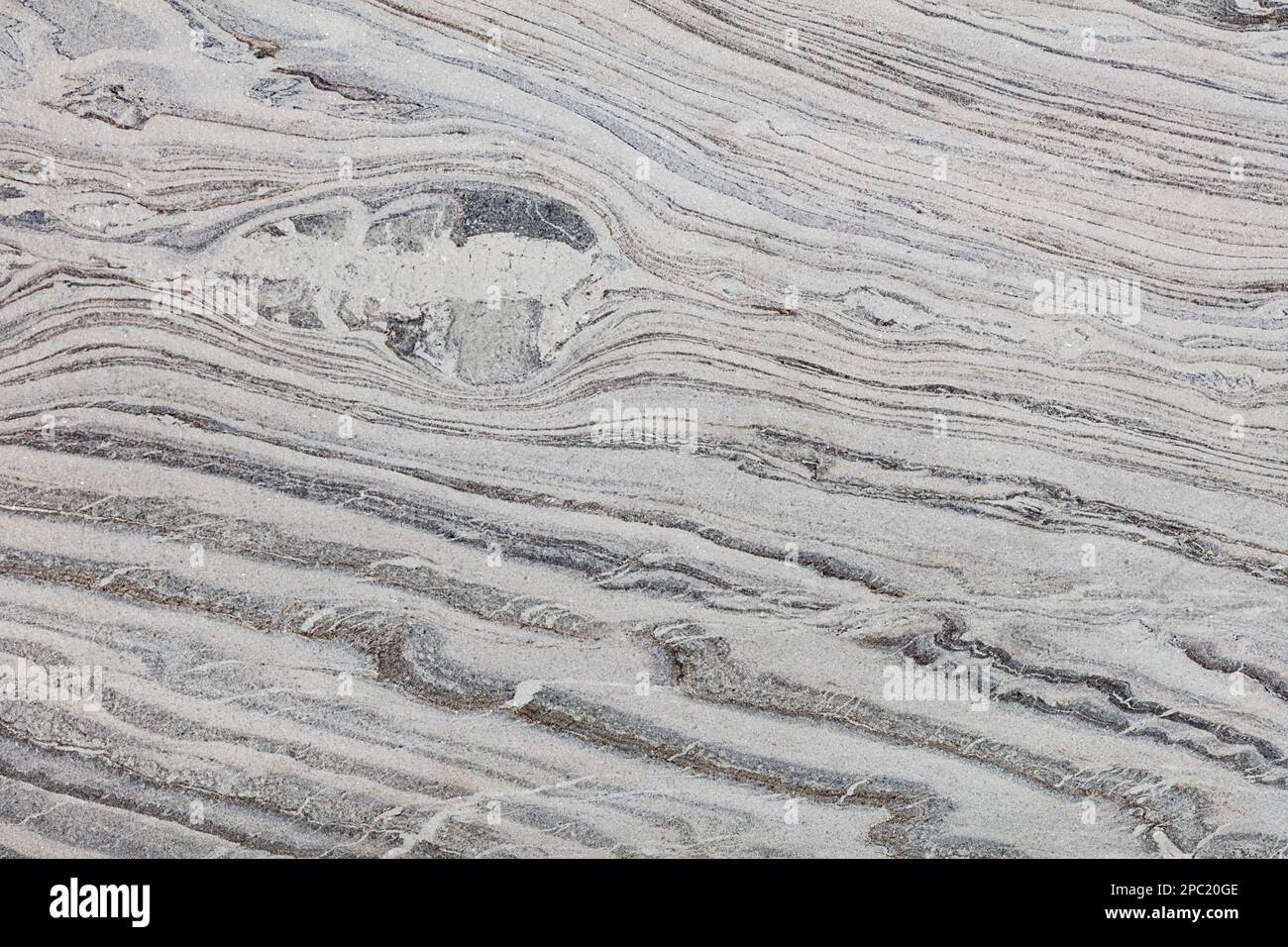 Texture de granit gris fumé avec nervures, rayures et taches diagonales. Banque D'Images