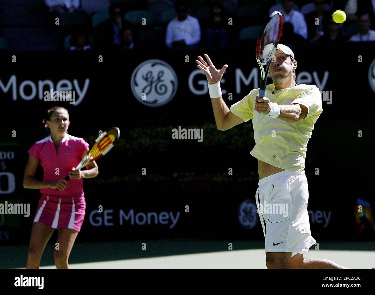 Daniel Nestor of Canada, right, and his partner Elena Likhovtseva of Russia, left, in action while playing Max Mirnyi of Beralus and compatriot Victoria Azarenka in their mixed doubles final match at the Australian Open tennis tournament in Melbourne, Australia, Sunday, Jan. 28, 2007. Nestor and Likhovtseva won in straight sets, 6-4 6-4. (AP Photo/Rob Griffith) Banque D'Images
