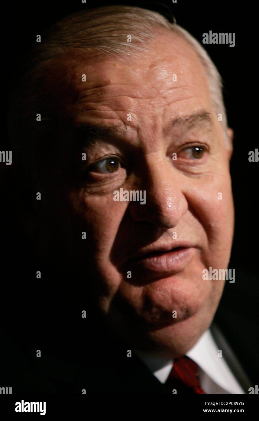 Louis DeNaples talks with his attorney before testifying in front of