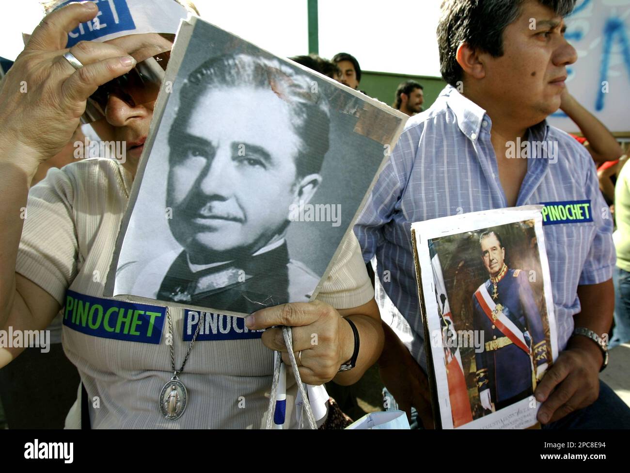 Supporters of former dictator Gen. Augusto Pinochet stand the Military ...