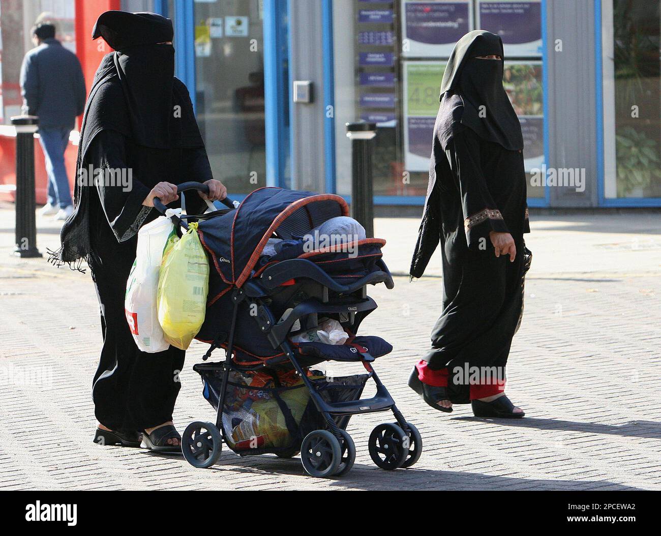 Two Muslim women walk through Blackburn city centre, the constituency